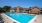 a swimming pool in front of a house