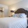 a bed with a white bed spread