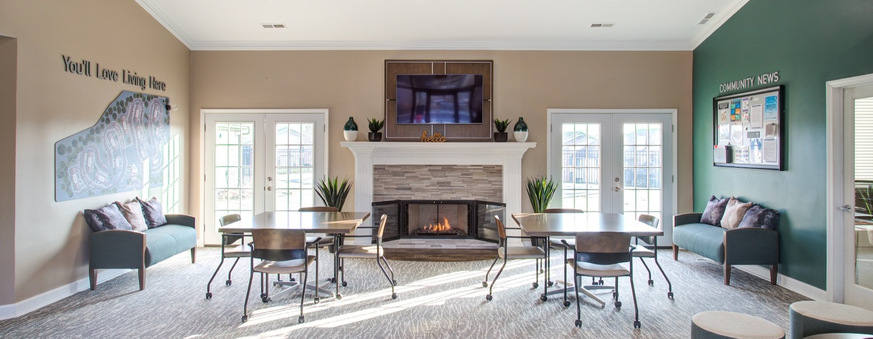 clubhouse with a fireplace and ample seating