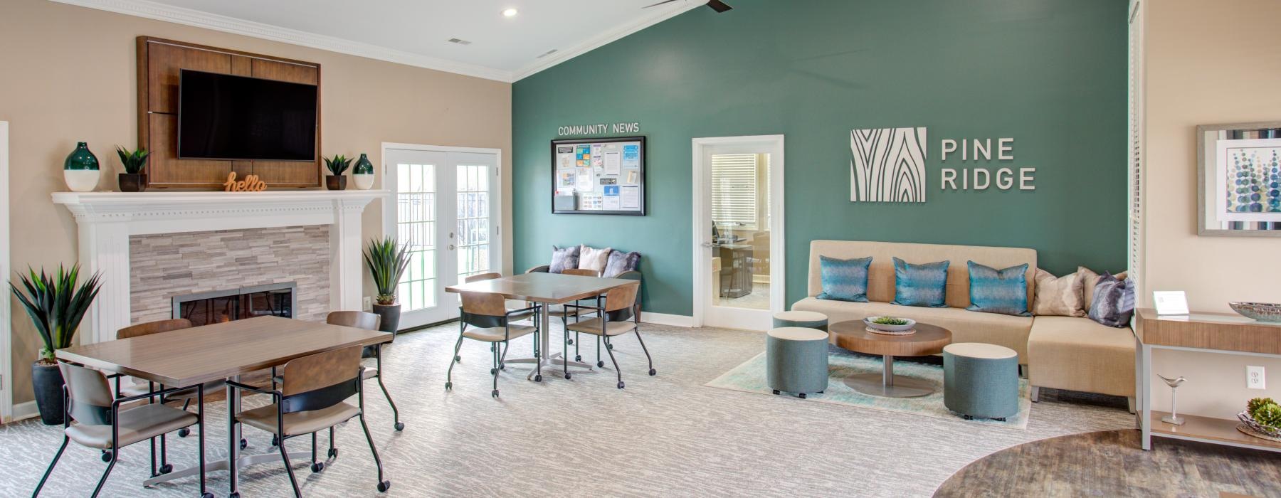 a lounge with a fireplace