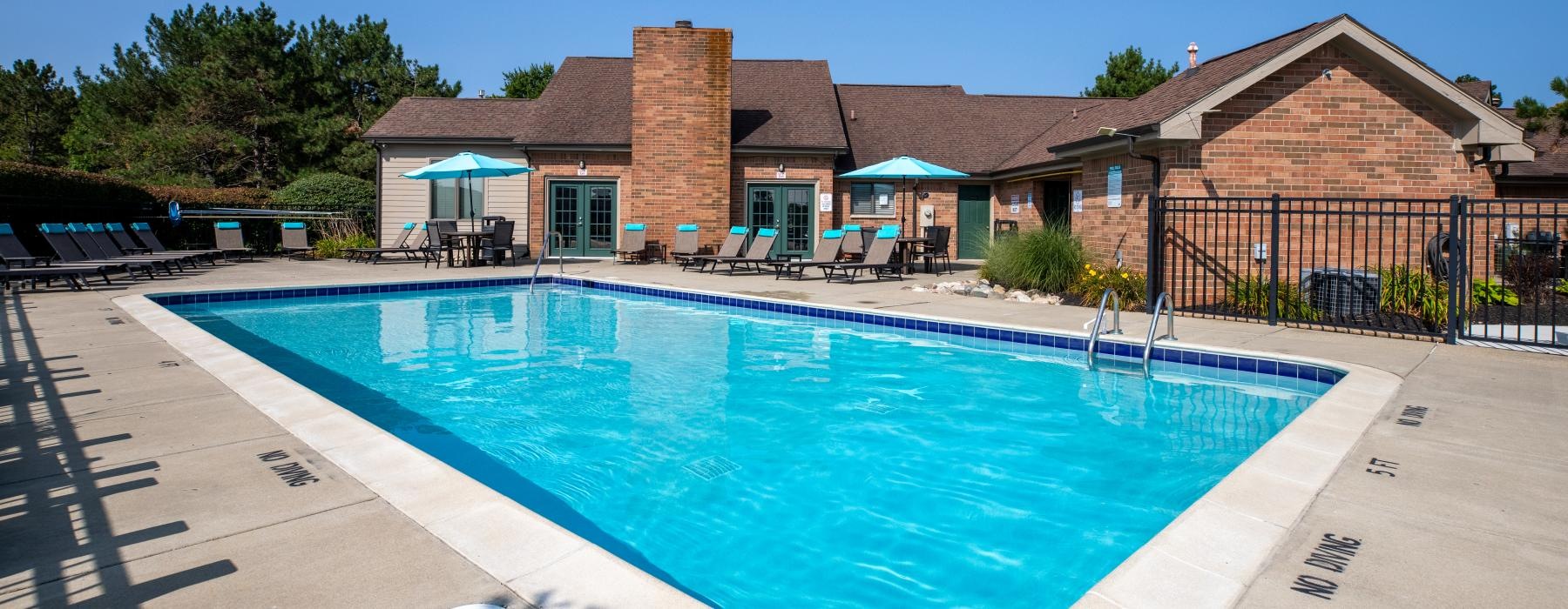 a swimming pool in front of a house